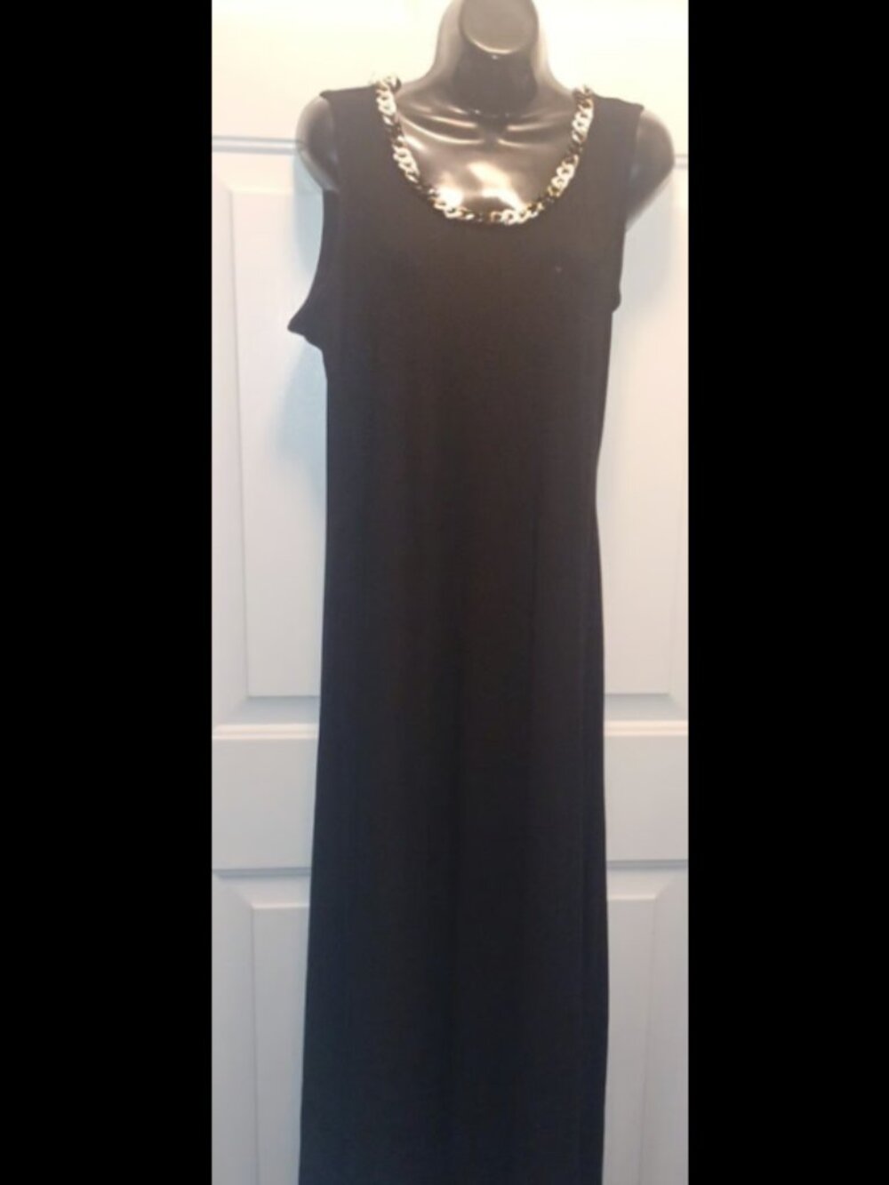 Toz and Ali black coverall with beads around the neck